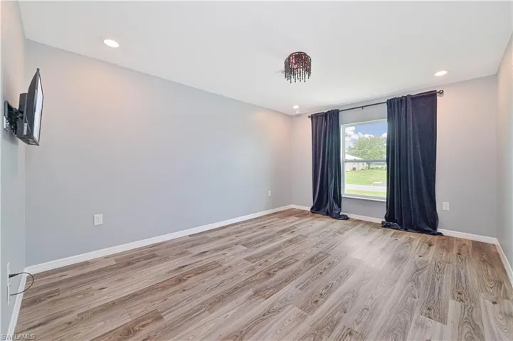 Unfurnished room featuring wood-type flooring