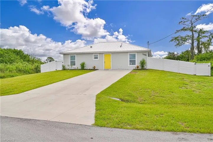 View of front of property with a front lawn