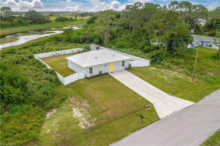 Birds eye view of property - note the Port LaBelle Greenbelt area with a beautiful lake in back! Privacy abounds!