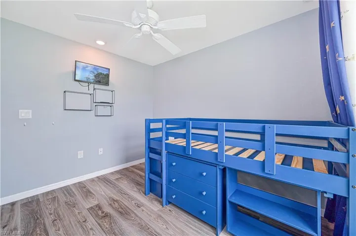Bedroom with wood-type flooring and ceiling fan