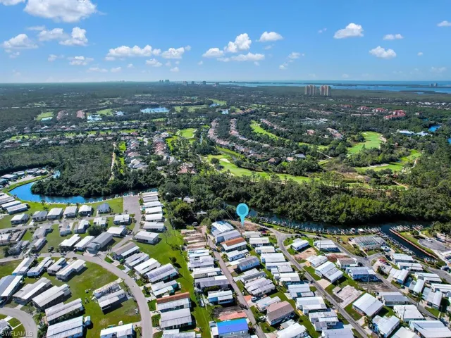 View of property location with nearby suburban area
