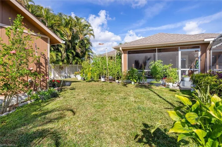 View of yard featuring a sunroom