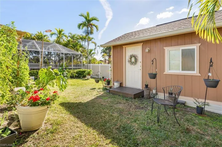 View of yard with a lanai