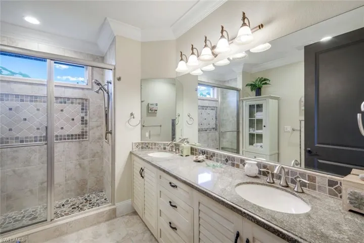 Suite #2 bathroom and pool bath with separate french doors to lanai