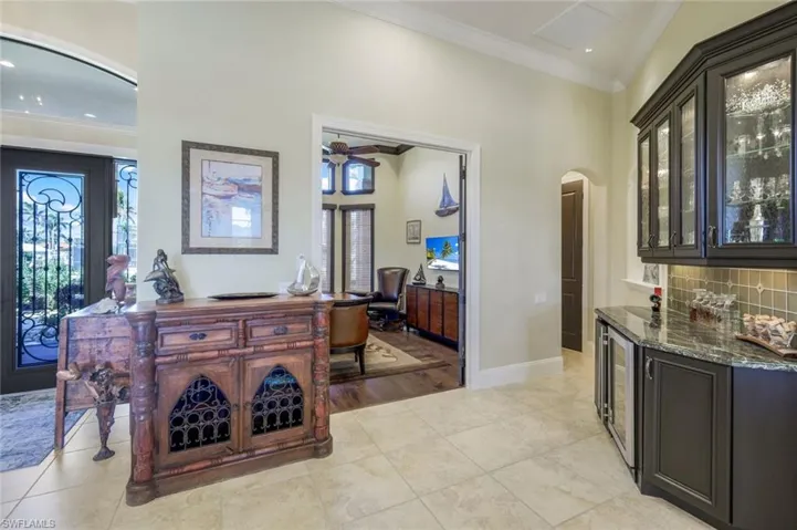 Bar area off the kitchen near the office gives you a glimpse of the entry doors