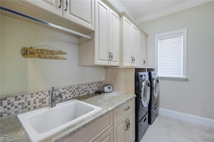 Laundry room with lots of cabinets