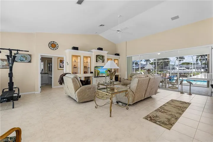 Large living room.  Open architecture with great views of pool and canal.