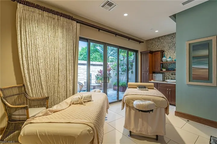 Living area featuring light tile patterned flooring and recessed lighting