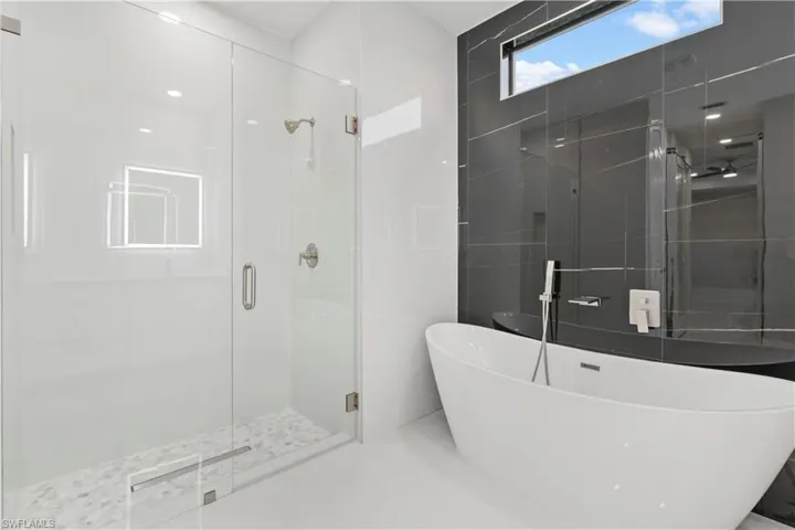 Bathroom featuring plus walk in shower