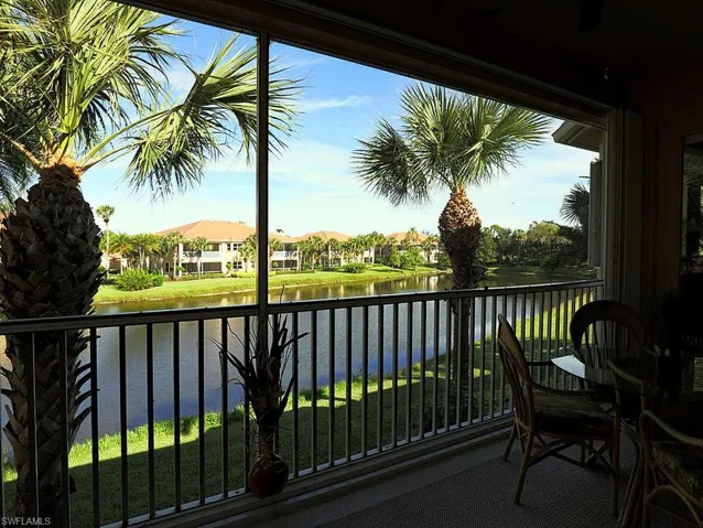 Balcony with a water view and a residential view
