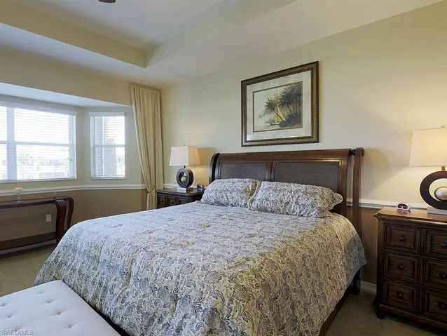 Bedroom featuring light carpet and ceiling fan