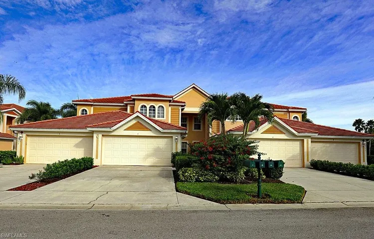 Mediterranean / spanish home featuring driveway, stucco siding, a garage, and a tile roof