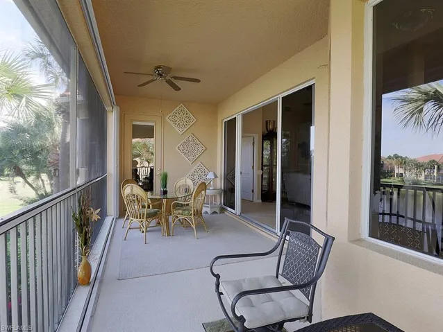 Sunroom with ceiling fan and outdoor dining space