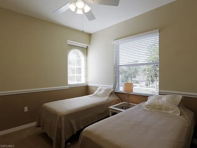 Bedroom with carpet flooring and ceiling fan