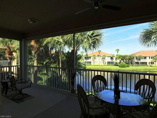 Balcony with a ceiling fan and outdoor dining space