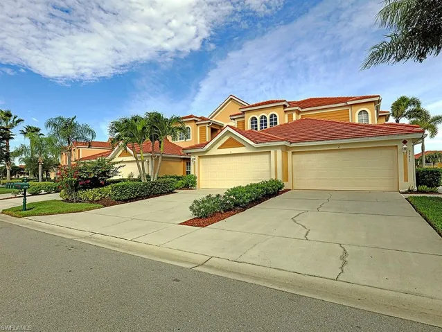 Mediterranean / spanish-style home featuring concrete driveway, stucco siding, an attached garage, and a tile roof