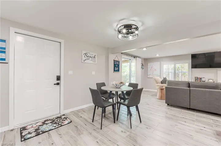 1st Floor Dining room featuring baseboards and light wood-style floors- Virtually Edited Image