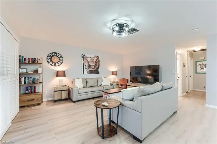 2nd Level Living room featuring baseboards and light wood-type flooring- Virtually Edited Image