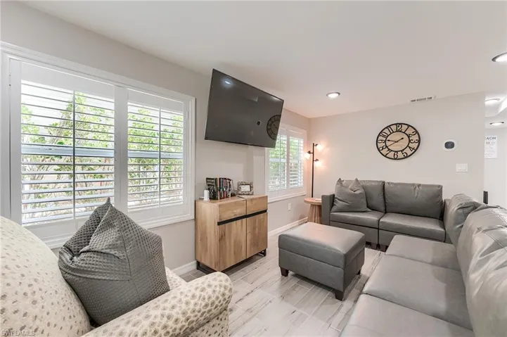 1st Floor Living area featuring baseboards and recessed lighting- Virtually Edited Image