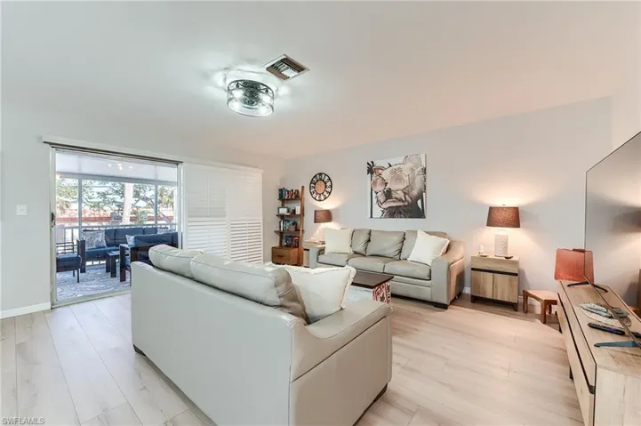 2nd Level Living area featuring light wood-type flooring and baseboards- Virtually Edited Image