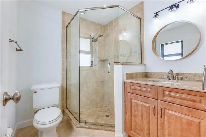 Tiled walk in shower in master bathroom
