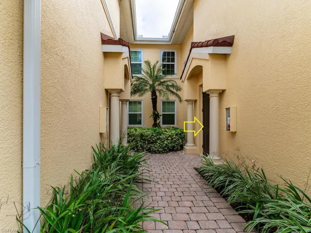 View of exterior entry featuring a patio