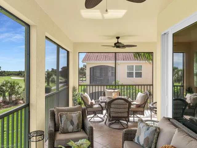 Sunroom featuring ceiling fan
