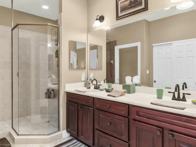 Bathroom with a shower with door and vanity