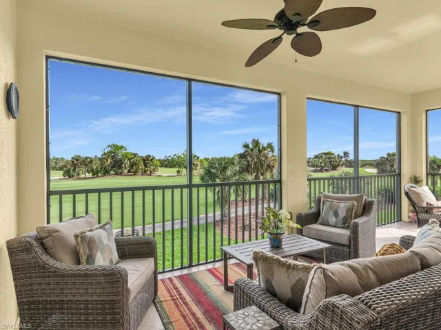 Sunroom / solarium featuring ceiling fan