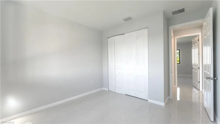 Unfurnished bedroom featuring a closet