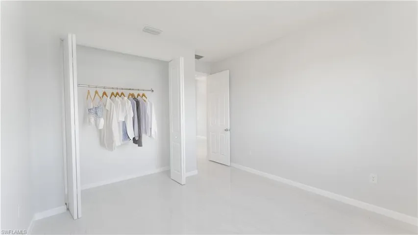 Unfurnished bedroom featuring a closet