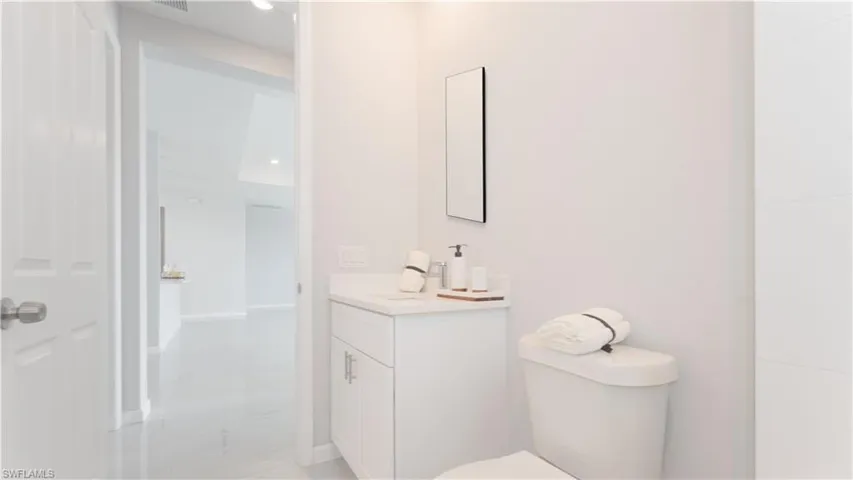 Bathroom featuring toilet and vanity