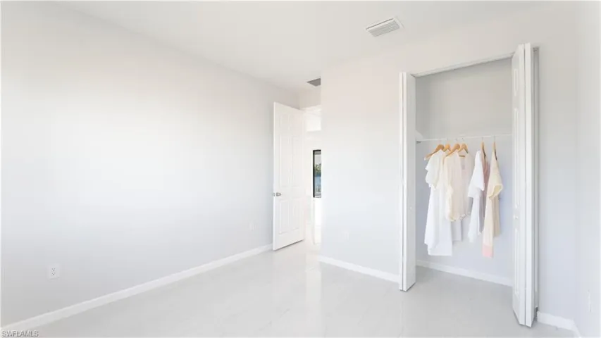 Unfurnished bedroom featuring a closet