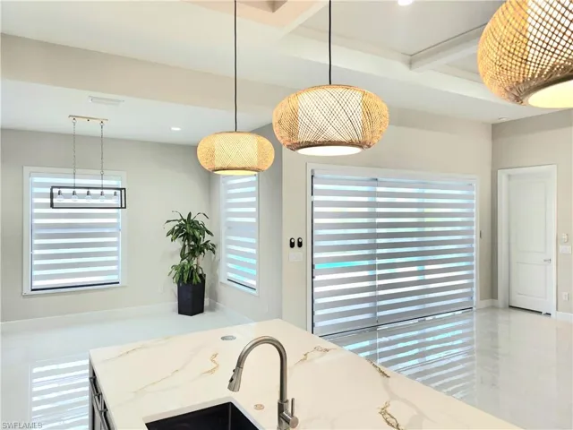 Bathroom with beam ceiling, coffered ceiling, and recessed lighting