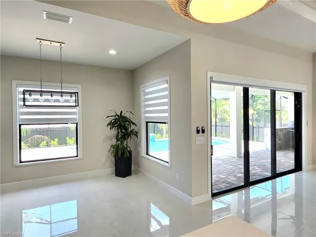 Unfurnished dining area featuring recessed lighting and light tile patterned flooring