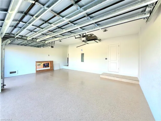 Garage featuring electric panel