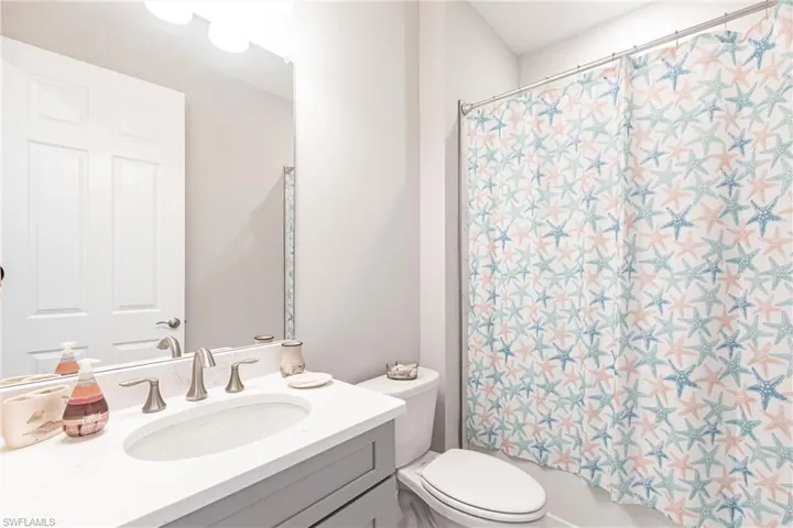 Quartz Counters ~ Wood cabinets~ Shower with Integrated Tub