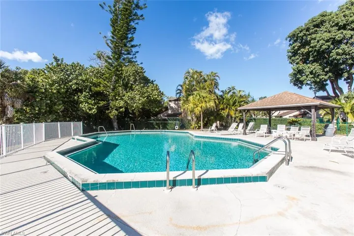 Community pool featuring a patio