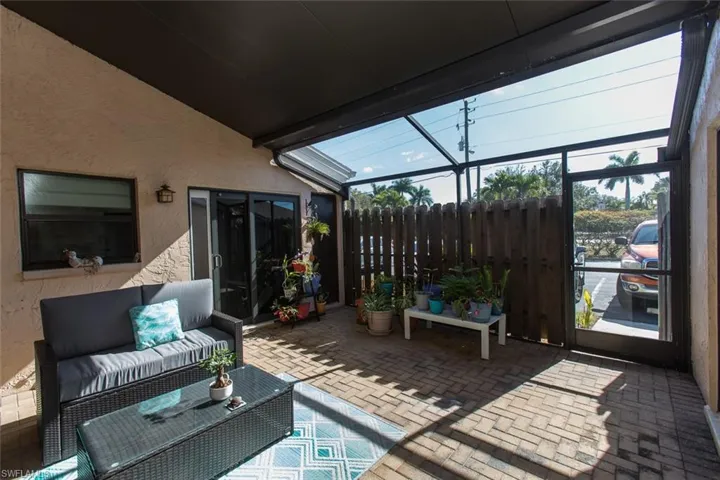 Sunroom / solarium with part ceiling,part screen  a patio area, and outdoor lounge area