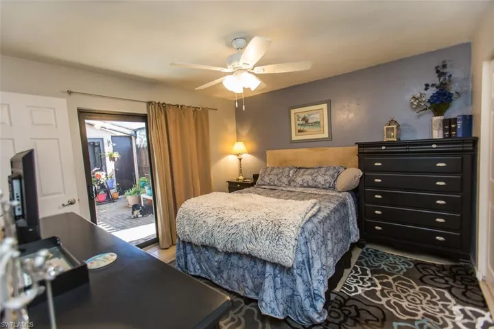 Bedroom with access to outside and a ceiling fan