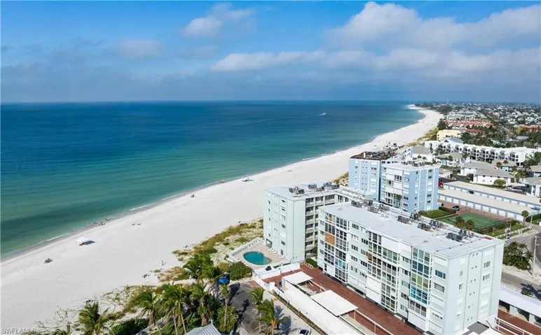 View of urban area featuring expansive coastline and apartment complex / building