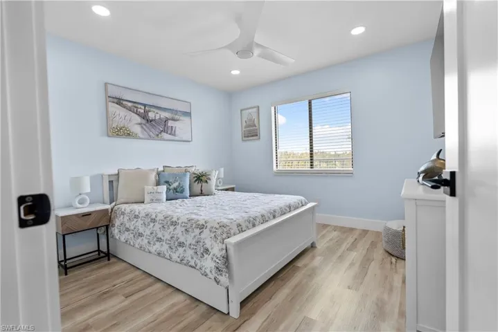 Bedroom with recessed lighting, baseboards, a ceiling fan, and light wood-style floors