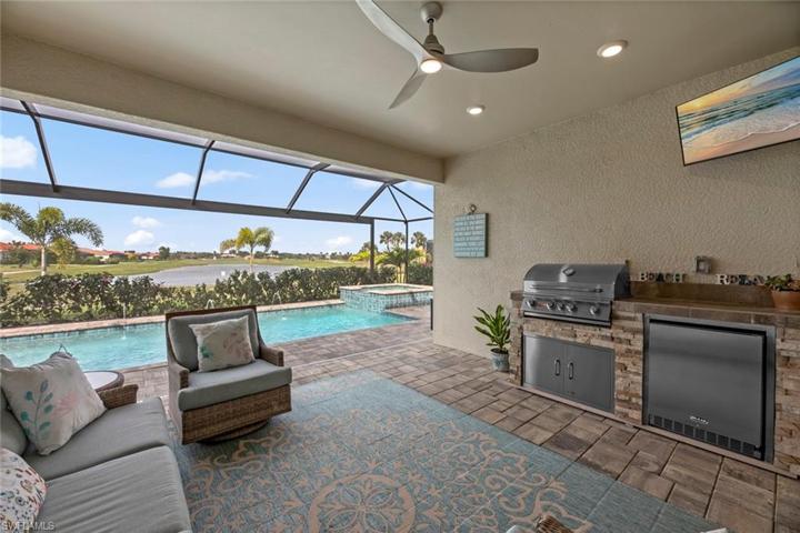 New outdoor kitchen with grill, refrigerator and mounted TV (June 2023), and new ceiling fan/light (October 2022)