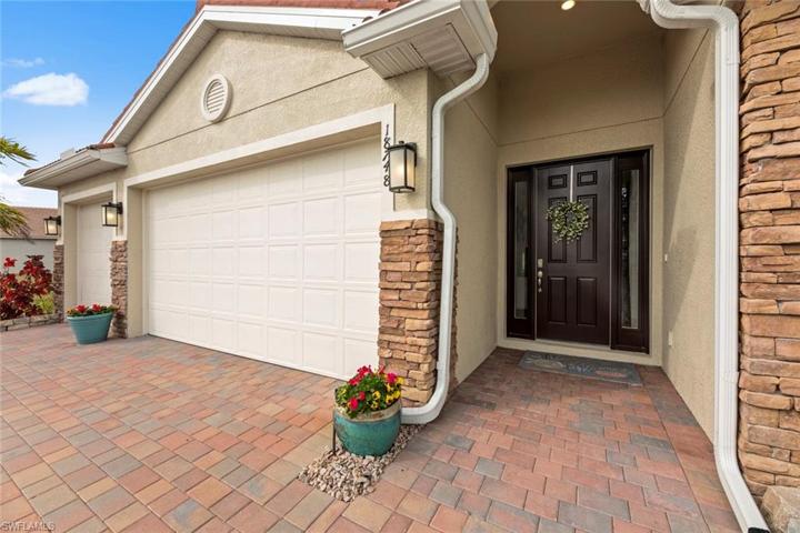 Four bedrooms, 3 full baths, 3-car garage, 2316 square feet under air and 3162 total square feet. Front door handle has a separate keypad entry pad.