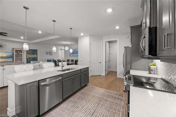 WALK-IN PANTRY located in the kitchen. New island pendants (November 2022)