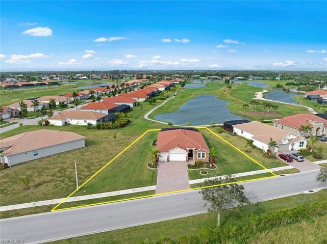 Large 1/3 acre plus WATERFRONT/GOLF COURSE LOT with long lake and SUNSET VIEWS. New landscaping and stone edging (April 2023)
