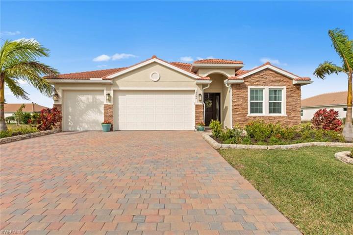 Three car garage has an EPOXY FLOOR and KEYPAD ENTRY. New landscaping and stone edging (April 2023). FURNITURE/DECOR is available for purchase outside of closing.