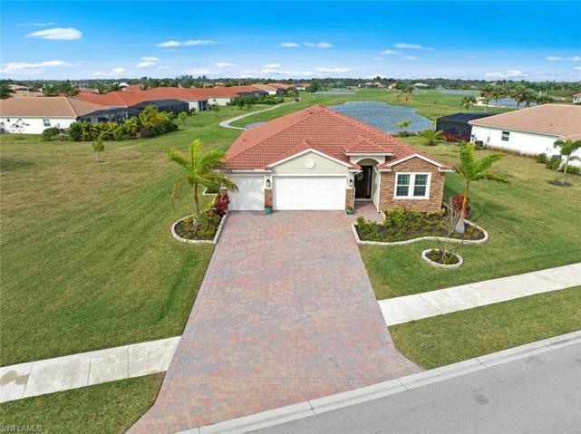 WELCOME HOME! Executive home with IMPACT GLASS WINDOWS/DOOR on over 1/3 acre WATERFRONT/GOLF COURSE LOT with SUNSET VIEWS and automatic irrigation system. New landscaping and stone edging (April 2023)