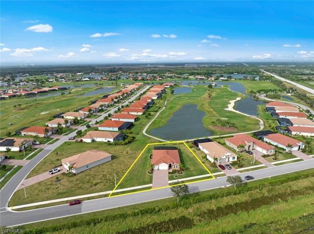 Large 1/3 acre plus WATERFRONT/GOLF COURSE LOT with long lake and SUNSET VIEWS. New landscaping and stone edging (April 2023)