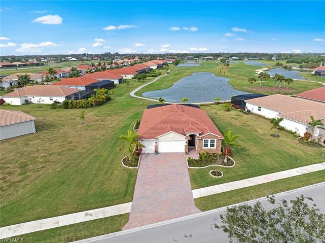 Large 1/3 acre plus WATERFRONT/GOLF COURSE LOT with long lake and SUNSET VIEWS. New landscaping and stone edging (April 2023)
